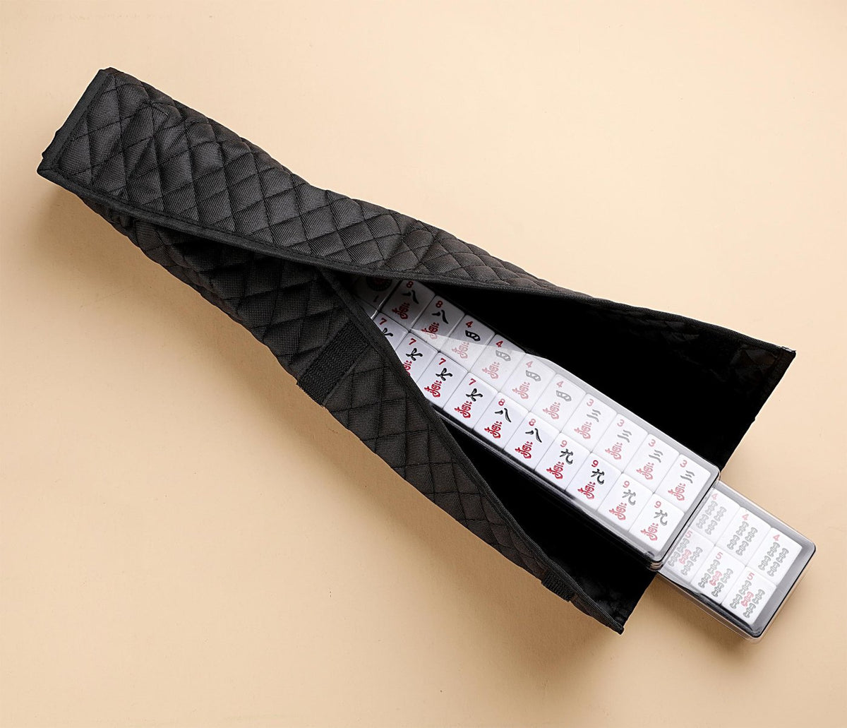 Black quilted rack cover holding a rack of tiles
