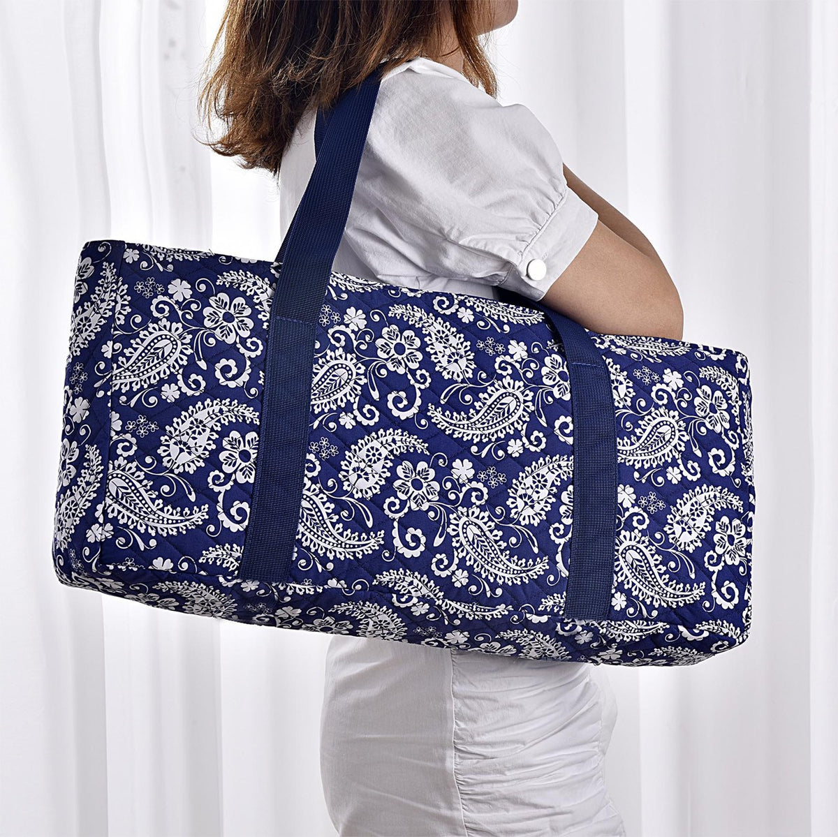 Blue paisley bag carried on the shoulder