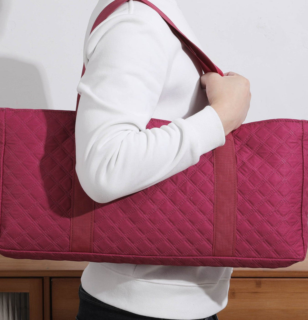 Red burgundy bag carried on the shoulder