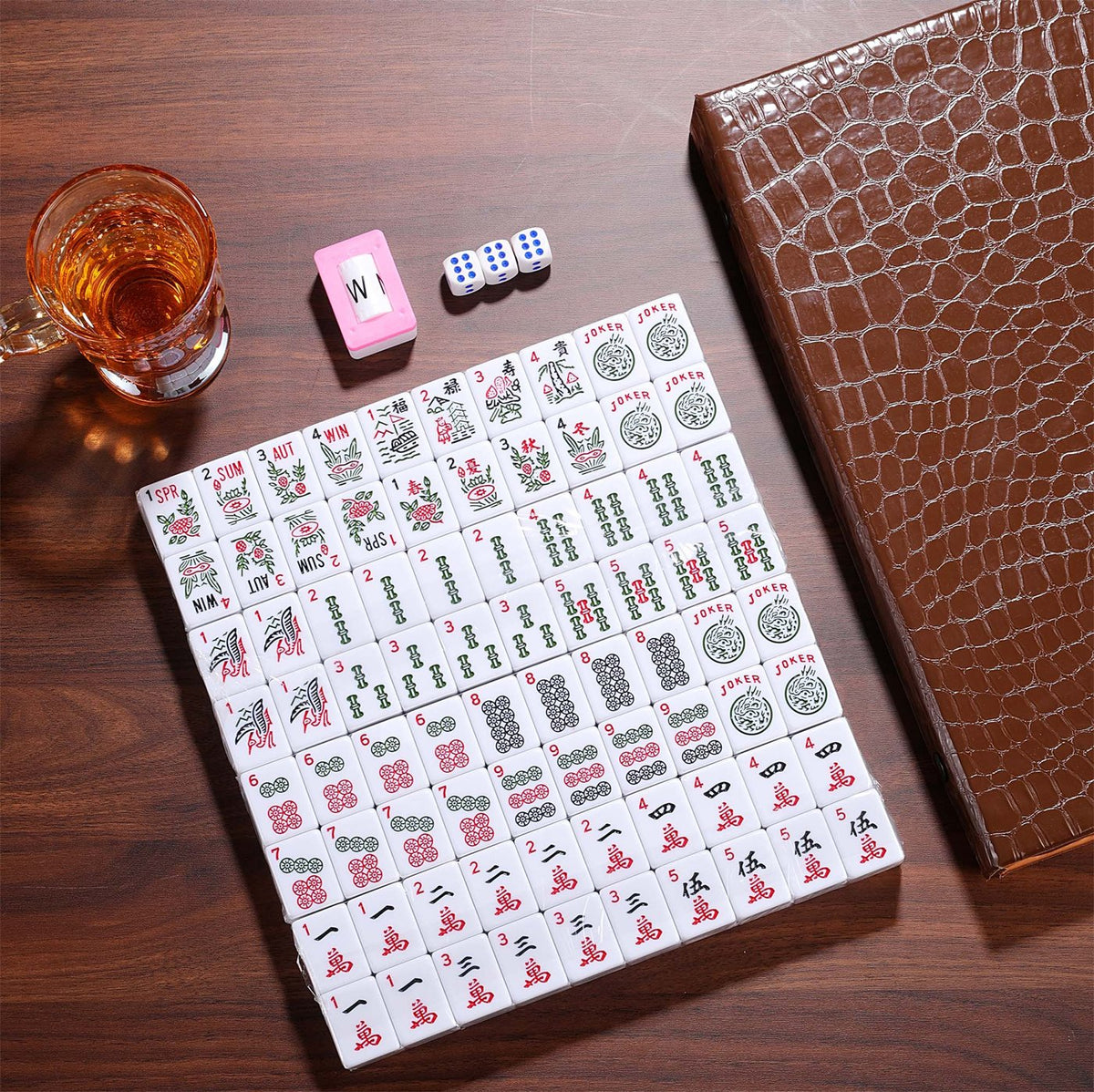 American mahjong tiles laid out beside the croc case
