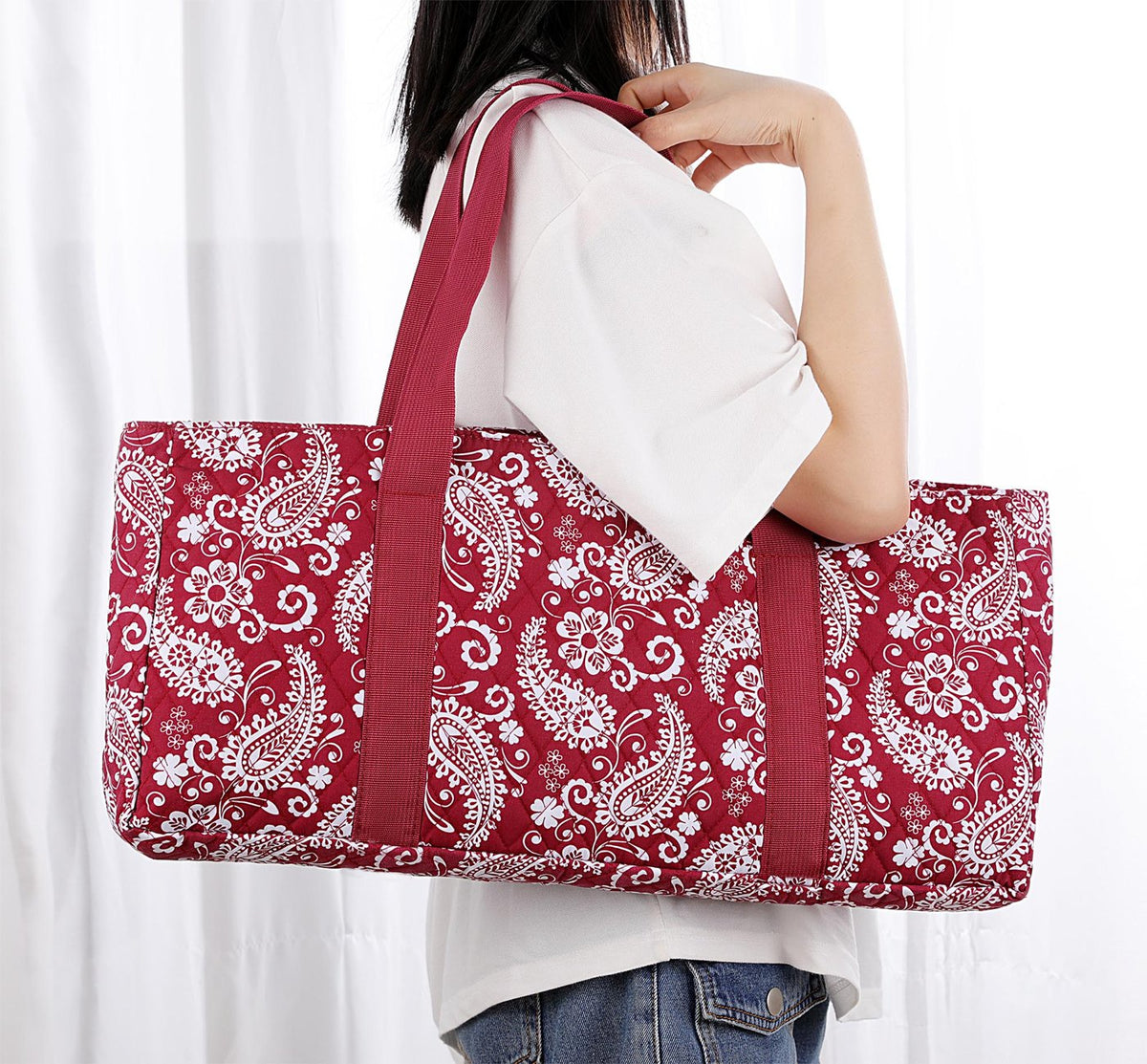 Red paisley bag carried on the shoulder