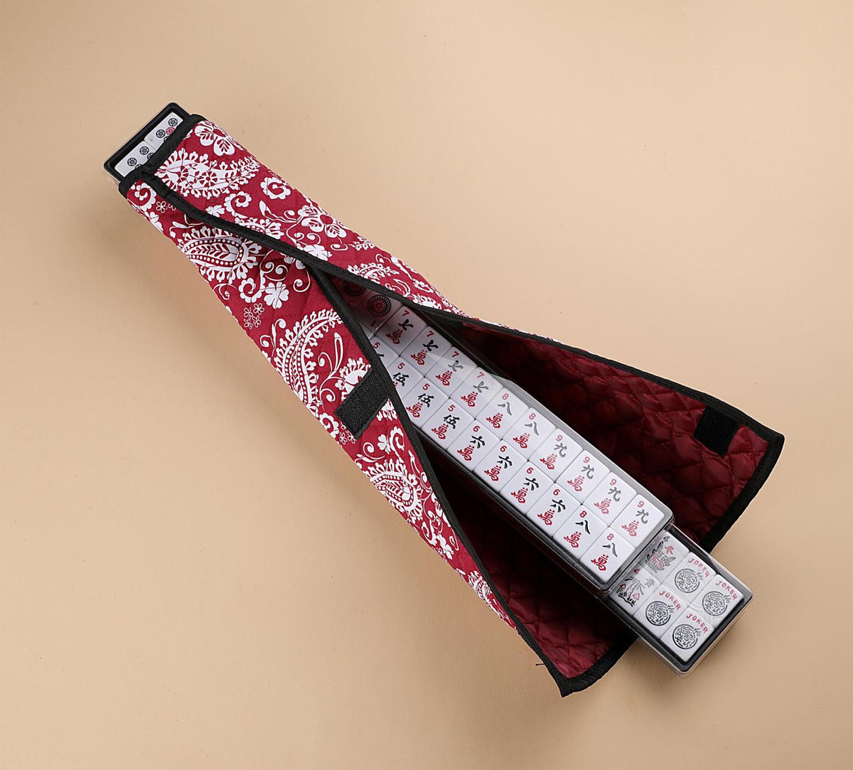 Red paisley rack cover holding a rack of tiles