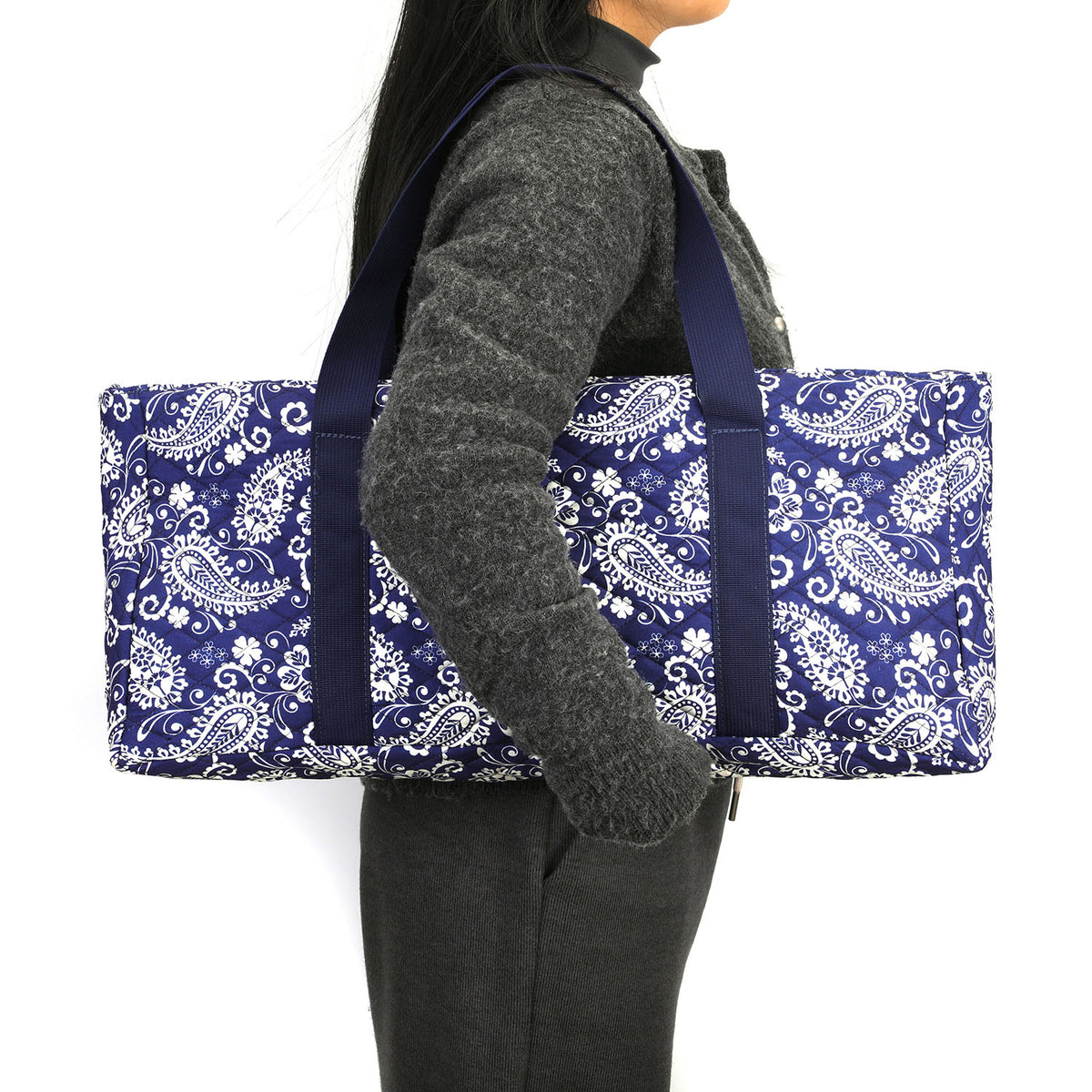 Navy paisley mahjong bag carried on the shoulder